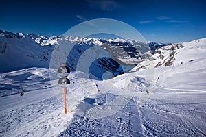Nebelhorn mountain top in winter black ski slope