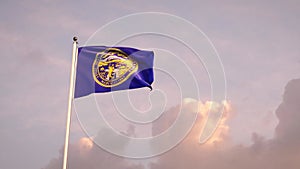 Nebraska flag fluttering with sky background. 4k 3d render