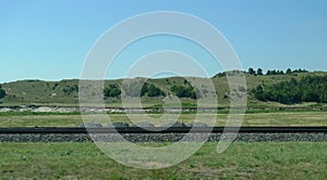 Nebraska Sandhills in rural central Nebraska, with railroad tracks photo