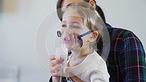 Nebuliser respiratory therapy of little girl