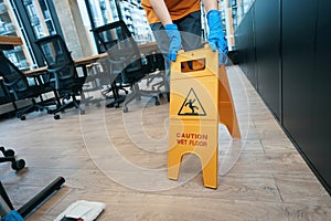Necessary gadgets for cleaning premises - mop and folding stepladder