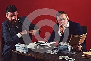 Necessary information. Successful investment in business. Businessmen write financial report while drinking and smoking