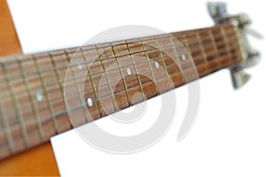 Neck of acoustic guitar isolated on white background, selective focus