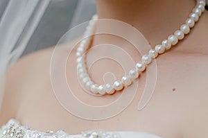 Neck of Bride with String of Pearls photo