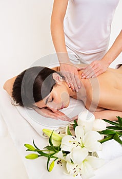 Neck massage of a beautiful woman. Massage and spa care