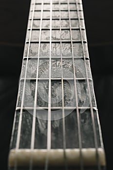 Neck of an old acoustic guitar photo