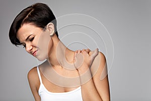 Neck Pain. Beautiful Woman Having Pain In Neck, Painful Feeling photo