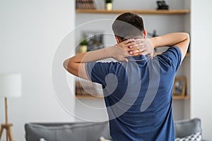 Neck pain, man suffering from ache at home