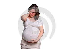 Neck pain in pregnant woman, studio shot on white background