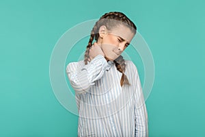 Neck pain, profile side view portrait of closed eyes sad girl in