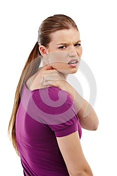 Neck pain, stress and portrait of girl in studio with anatomy, emergency or inflammation on white background. Shoulder