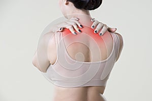 Neck pain, woman with backache on beige background
