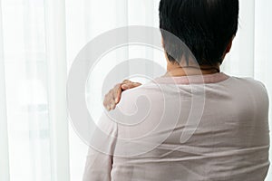 Neck and shoulder pain, old woman suffering from neck and shoulder injury, health problem concept