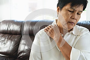 Neck and shoulder pain, old woman suffering from neck and shoulder injury, health problem concept