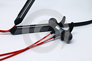 Neckband image. Bluetooth headset image. Red wired bluetooth earphones. Wireless headset photo