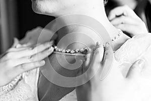 Necklace around the bride`s neck