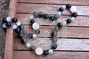 Necklace of black and moonstone beads