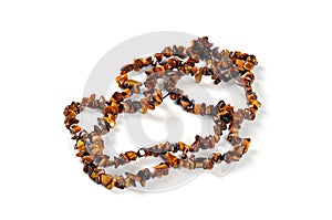 Necklace made of semi-precious stones, on white background;