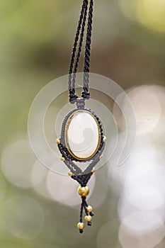 Necklace on natural background with moonstone