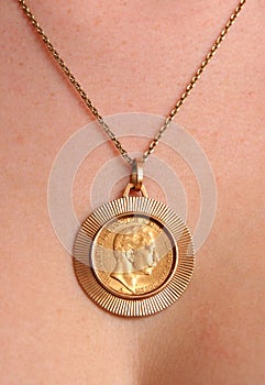 Necklace with old gold coin.