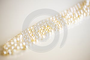 Necklace of the pearl on a white background and close up