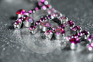 Necklace with pink gem close-up on a light background