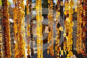 Necklaces amber of different colors and sizes on Jomas street in Majori