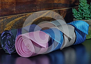 neckties on the table on wooden background. classic style