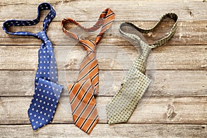 Neckties on wooden background. Top view. Father`s Day.