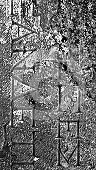 Necropol. Inscription Carved on Stone. Vertical Monochrome Stock Photo