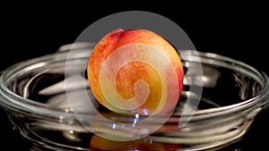 Nectarine Fruit on Transparent Plate, Close Up Spinning