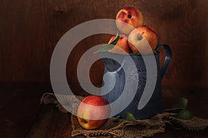 Nectarines in a garden jug