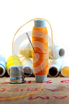 Nedle with orange color thread