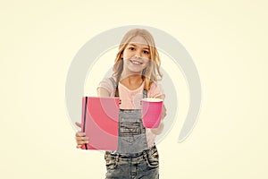 Need a boost. Cute girl holding tea cup and note book. Small kid enjoying her morning tea. Little baby drinking tea with