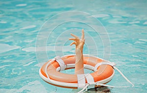 Need a help. Drowning person. Life problems. Rescue swimming ring in water. Safety water equipment.