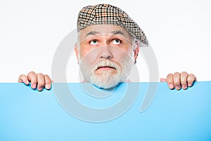 Need an inspiration. wanted. Copy space placate information. thinking mature man in retro hat. Senior bearded man place