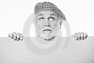 Need an inspiration. wanted. Copy space placate information. thinking mature man in retro hat. Senior bearded man place