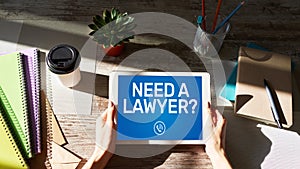 Need a lawyer Call now message on screen. Attorney at law, Legal assistance online.