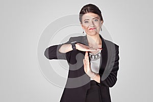 Need pause. Businesswoman showing time out sign