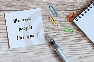 We need people like you written on peace of paper at human resources manager workplace