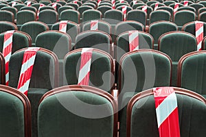 Need to sit on a chair separated by a ribbon in the cinema, theater, auditorium. Maintaining a safe social distance in public