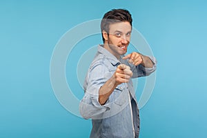 We need you! Portrait of cheerful happy man in worker denim shirt noticing and pointing finger to camera