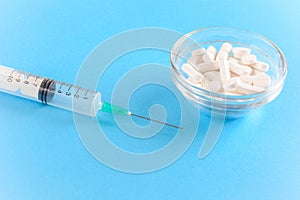 Needle with drug pills. Drug addiction concept