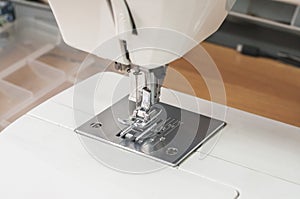 Needle and foot of sewing machine
