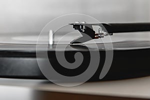 A needle playing an old vinyl. Close-up view
