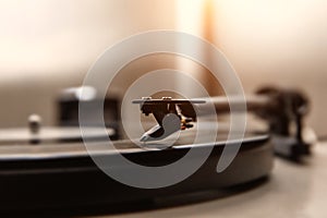 A needle playing an old vinyl. Close-up view