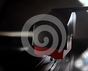 The needle of an record player in close up view