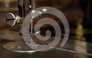 Needle sewing machine close-up.