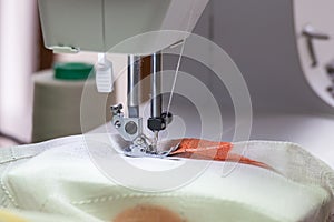 Needle of the sewing machine close-up