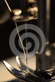 Needle of a sewing machine close-up